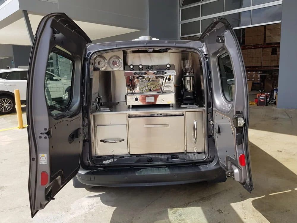 Reference photograph of a compact rear-service coffee van