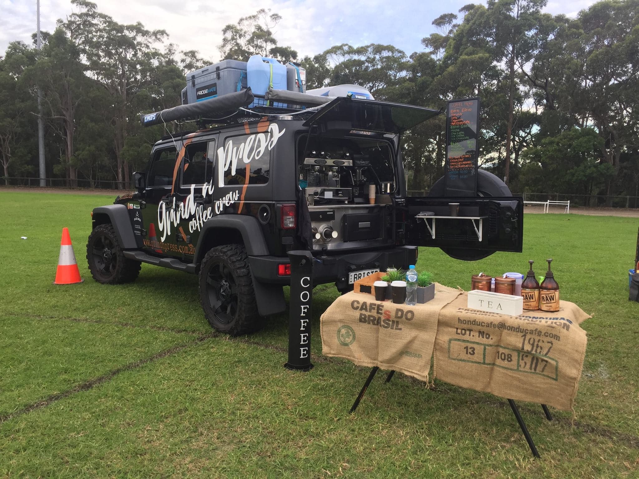 Reference photograph of an SUV serving coffee from its rear hatch